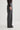 Person wearing gray pants on a white background