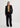 Person wearing a black suit on a white background
