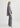 Woman wearing a gray outfit on a white background