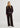 Person wearing a dark brown jacket and pants on a white background