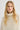 Woman wearing a cream-colored sweater against a white background