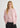 pink cashmere crewneck cardigan worn with grey wide leg pants