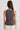Woman wearing brown tank top