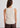 Woman wearing cream tank