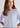 Woman wearing pale blue cashmere t-shirt
