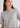 Woman wearing grey cashmere t-shirt