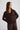 Woman wearing chocolate v-neck sweater