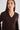 Woman wearing chocolate v-neck sweater