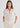 Woman in cream cashmere polo shirt