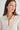 Woman in cream cashmere polo shirt