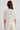 Woman in cream cashmere polo shirt
