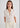 Woman in cream cashmere polo shirt