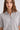 Woman in a grey cashmere shirt