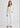Woman in cream cardigan