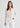 Woman in cream cardigan