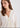 Woman in cream cardigan