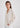 Woman in cream cardigan