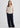 Woman in beige v-neck cardigan