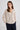 Woman in beige v-neck cardigan