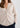 Woman in beige v-neck cardigan