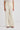 Woman wearing cream trousers