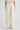 Woman wearing cream trousers