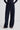 Woman wearing navy trousers