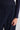 Woman wearing navy trousers