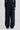 Woman wearing navy trousers