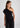 Woman wearing black one shoulder top
