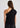 Woman wearing black one shoulder top